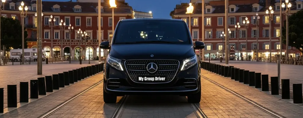Private chauffeur Nice: black Mercedes V-Class at night on Place Masséna