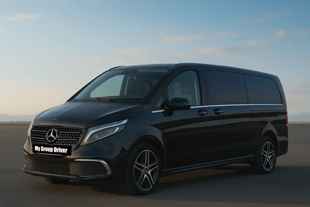 Mercedes V-Class chauffeur: black V-Class van on a runway at dusk